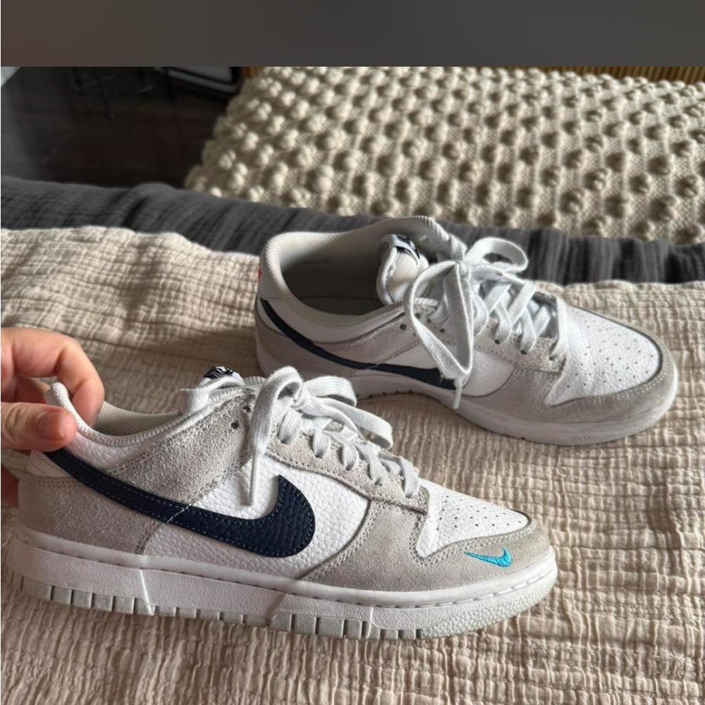Nike White Low-Top Sneakers with Navy Swoosh and Teal Accent